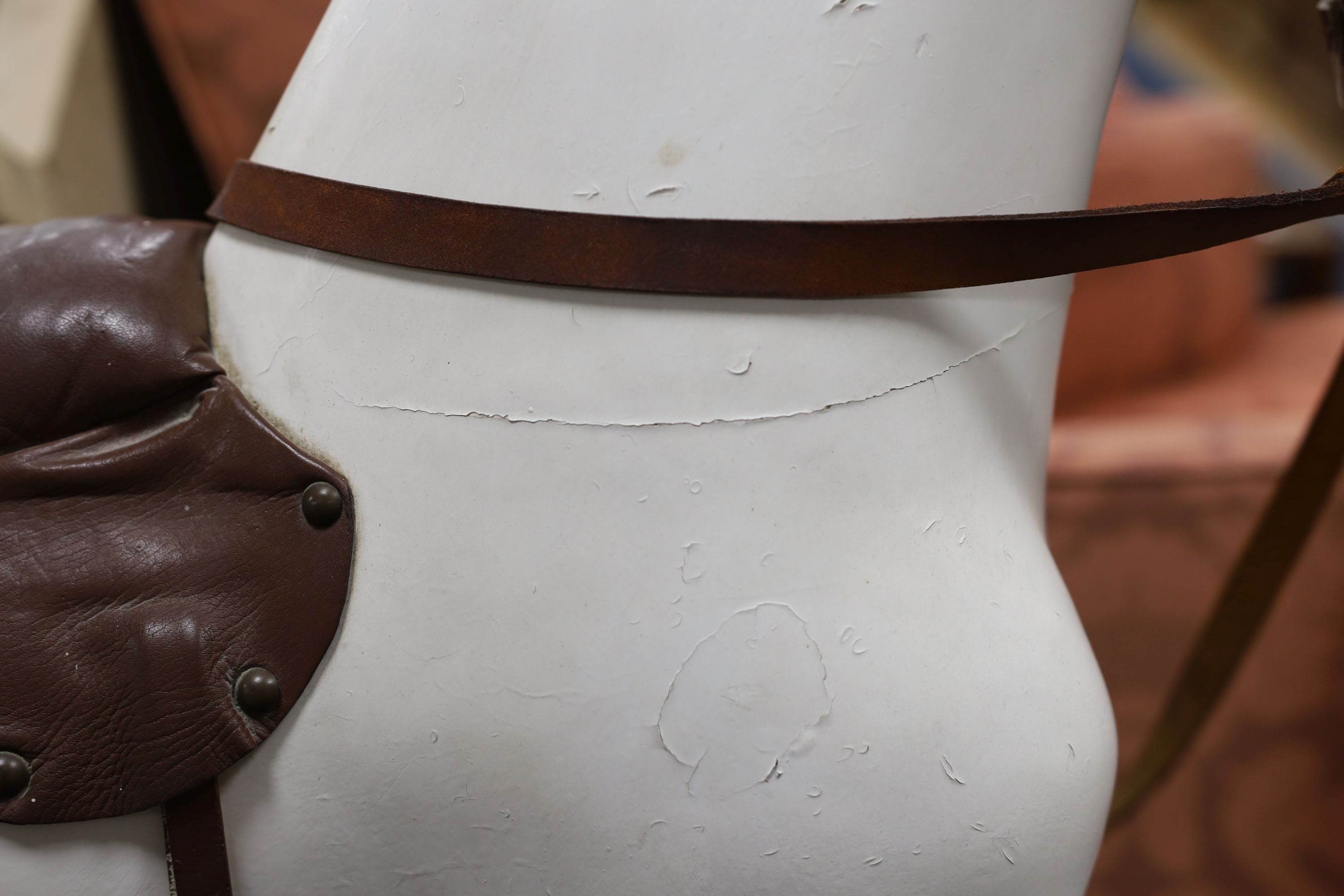 An early 20th century rocking horse on painted safety frame, (re-painted) width 126cm, height 114cm